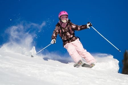 Girl Skiing Against Blue Sky
